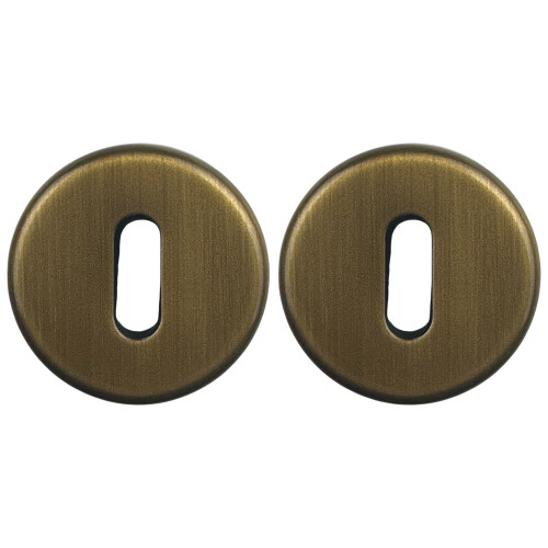 ROSACE RONDE EN LAITON PATINE CLE