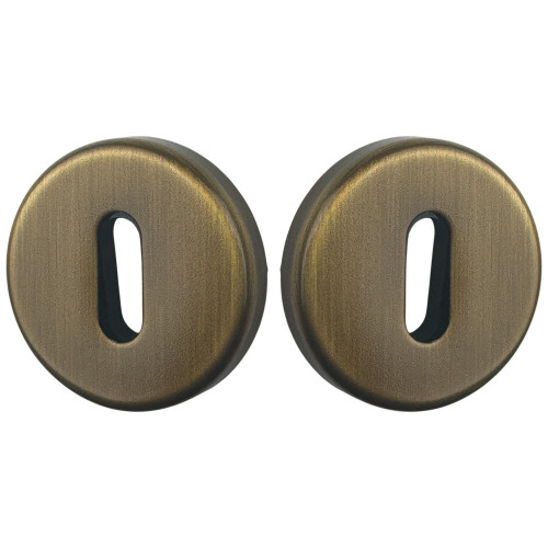 ROSACE RONDE EN LAITON PATINE CLE