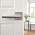 2 poignées de porte sur rosace carrée BRUNELLA, Ressort bidirectionnel, Inox nickel mat