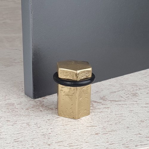 Butée de porte sol HEXAGONE, Laiton doré anneau Caoutchouc noir