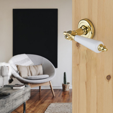 poignée de porte sur rosace ronde à liseré en laiton doré et porcelaine blanc PLATON vue 1